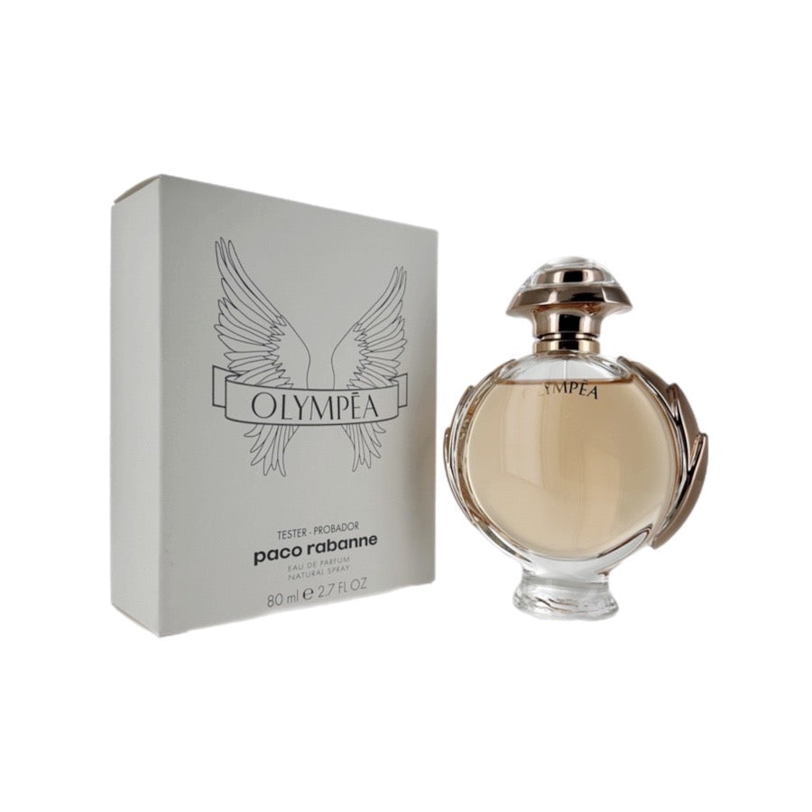 Paco Rabanne Olympea Eau de Parfum spray bottle next to its white box packaging with the brand's logo and the word 'Tester' on it.