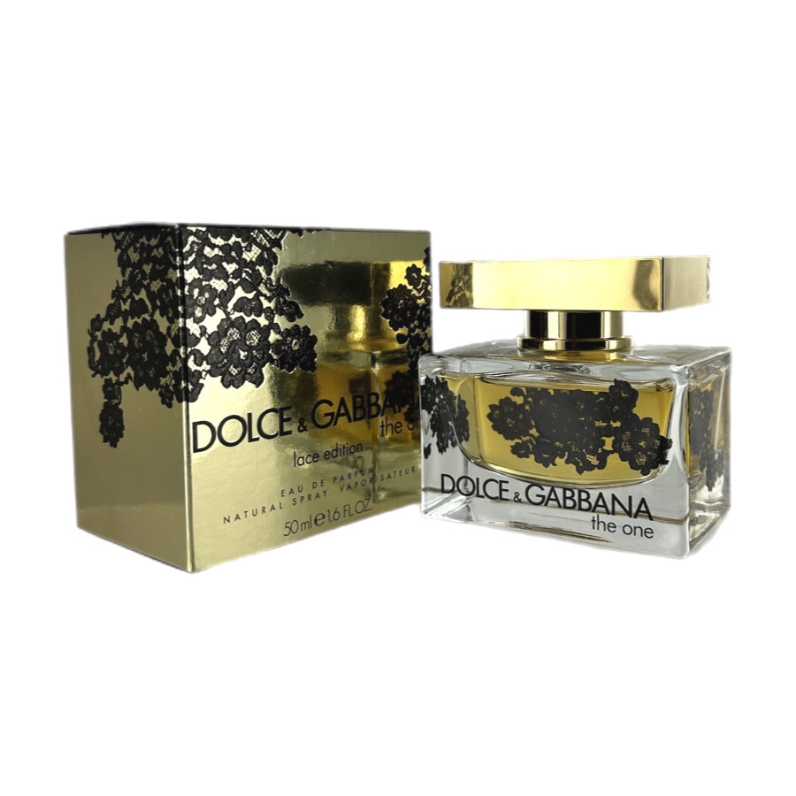 Dolce & Gabbana The One Lace Edition EDP bottle and box. The bottle is clear with black and gold labeling, and the box is gold with black lace design.