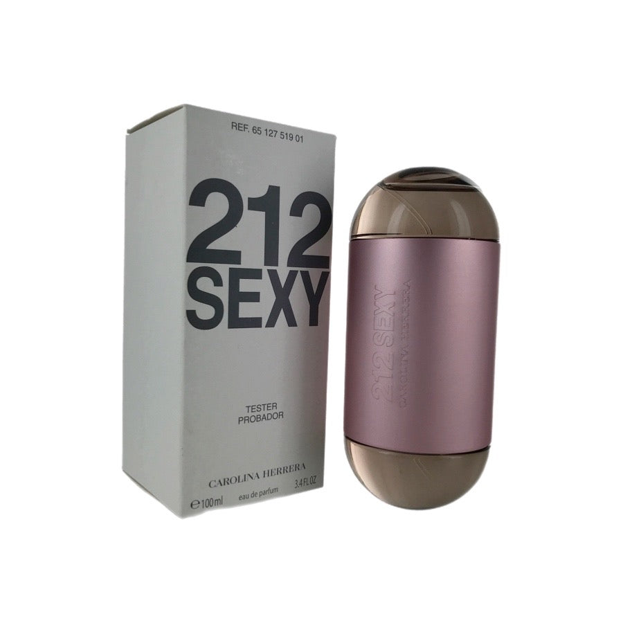 A Carolina Herrera 212 Sexy eau de parfum spray bottle in pink color, alongside its white box packaging with '212 SEXY' printed in black.