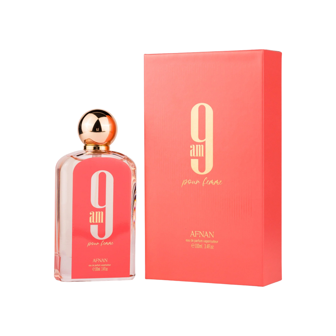A pink bottle of Afnan 9am Pour Femme EDP with a gold cap, alongside the box packaging. The bottle has text and the brand logo printed on it.