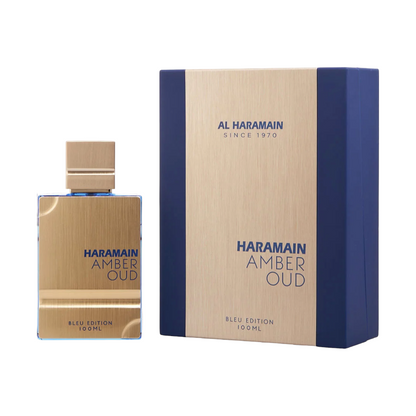 Al Haramain Amber Oud Blue Edition EDP bottle and packaging, with the bottle positioned in front of the box which has the brand and product name visible.