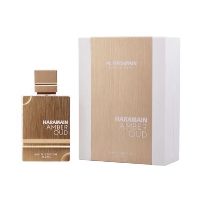 Al Haramain Amber Oud White Edition EDP perfume bottle and packaging, showing the fragrance bottle beside the box with branding and 'White Edition' text.