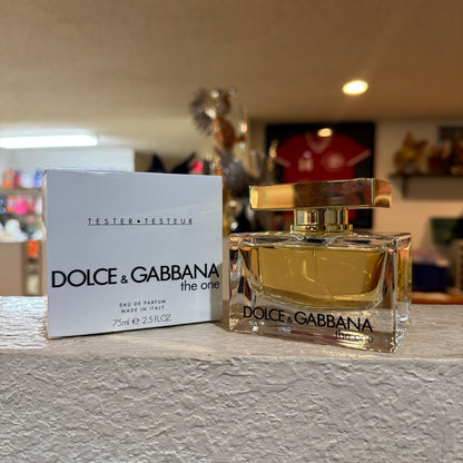 Dolce & Gabbana perfume bottle and packaging on a surface with a blurred background