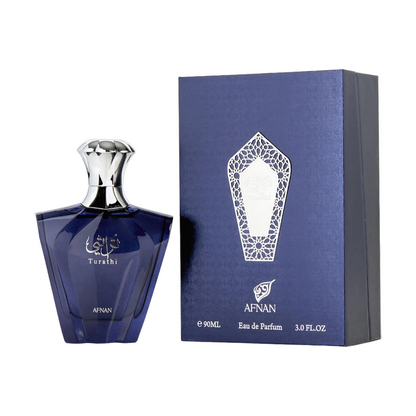 A blue bottle of Afnan Turathi Blue EDP with a silver cap, alongside a blue box with gold designs.