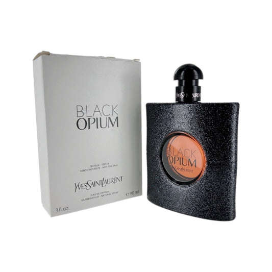 Black Opium Eau de Parfum Spray bottle and packaging, with the brand Yves Saint Laurent visible.