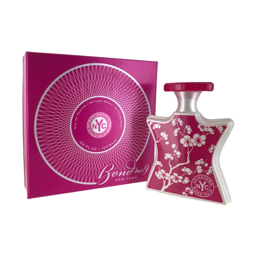 Bond No. 9 Chinatown EDP bottle and packaging, featuring a pink label with floral design and the brand's logo.