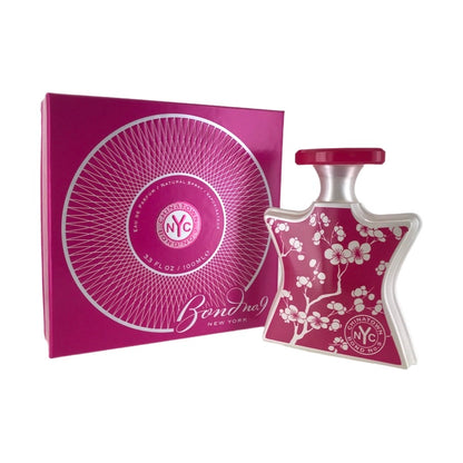 Bond No. 9 Chinatown EDP bottle and packaging, featuring a pink label with floral design and the brand's logo.
