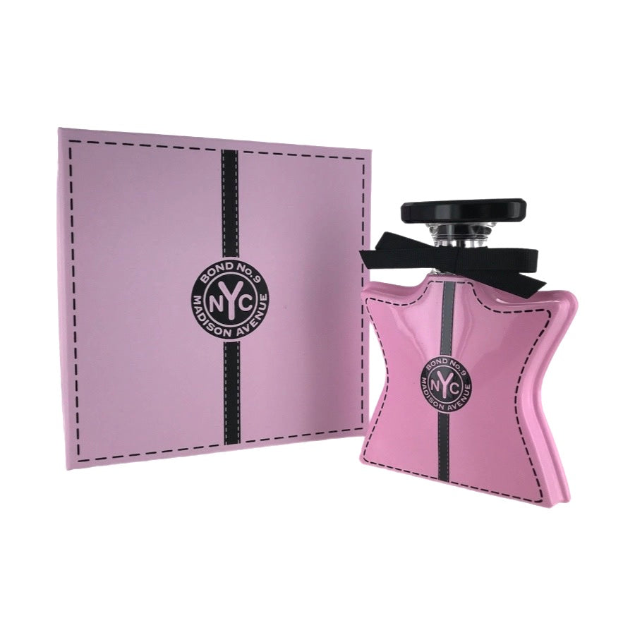 A pink bottle of Bond No. 9 Madison Avenue EDP with a black cap and a white label, in front of its original packaging.