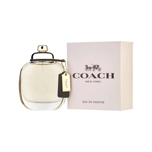 A Coach branded perfume bottle with a gold-colored cap and tag, alongside a pink box labeled 'Coach' and 'Raise A Perfume'.