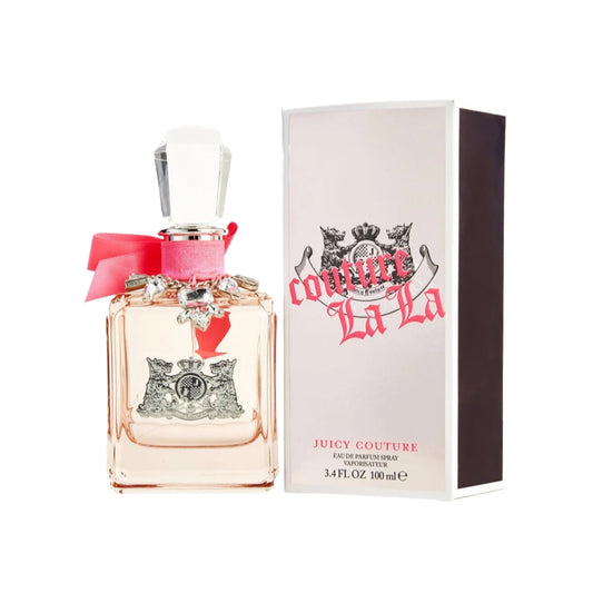A pink bottle of Juicy Couture eau de parfum spray with a decorative bow, alongside its black packaging box with the brand's logo and 'COUTURE LA LA' text.