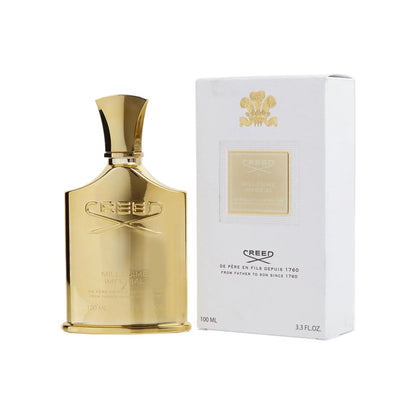 A bottle of Creed Millesime Imperial EDP next to its white packaging box with a gold emblem.