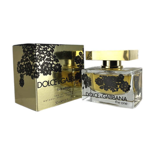 Dolce & Gabbana The One Lace Edition EDP bottle and box. The bottle is clear with black and gold labeling, and the box is gold with black lace design.