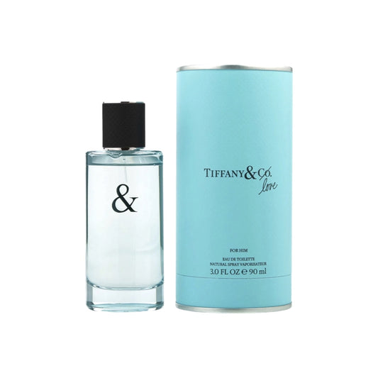 A bottle of Tiffany & Love EDT for Him alongside its teal packaging. The bottle is clear and the cap is black.